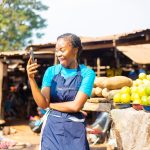 excited-african-market-woman-using-mobile-phone_505521-506_large